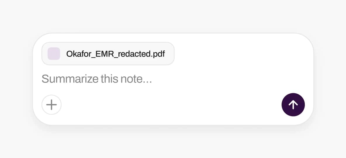 A redacted PDF attached to an AI chat composer.